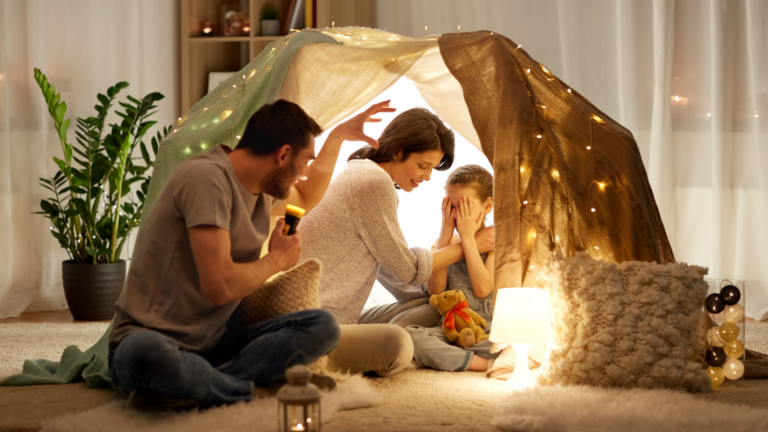 Mother father and child in an indoor fort