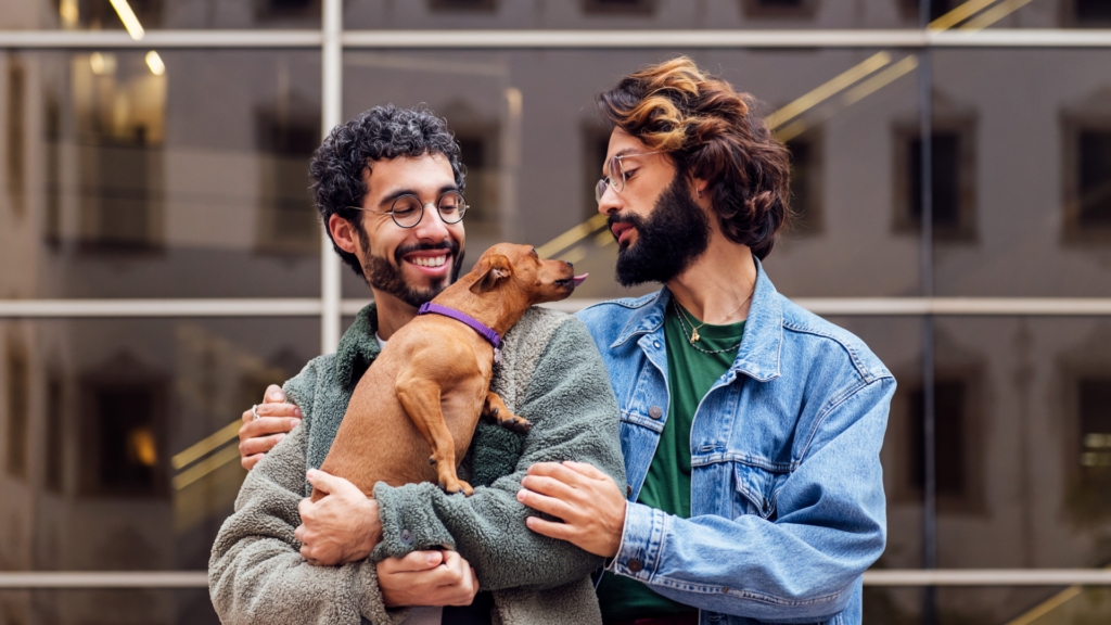 couple holding small dog