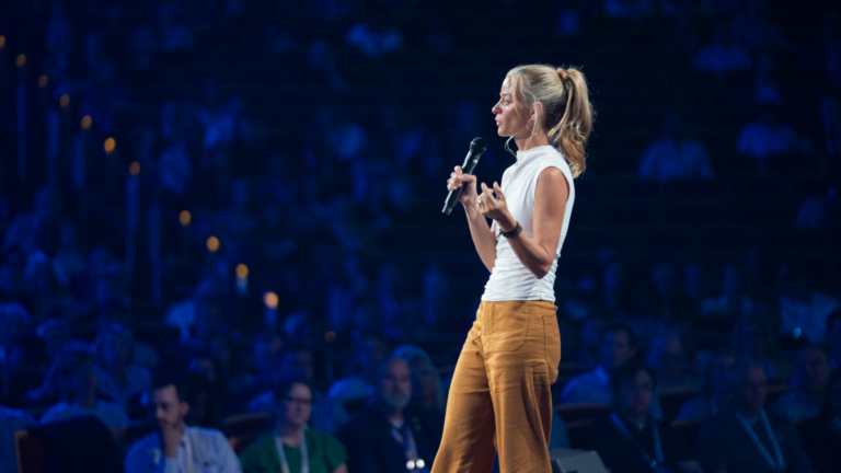 Quility Co-Founder Meredith Ellison on stage at 2023 national conference