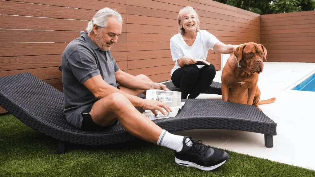 man and woman with their dog just purchased life insurance