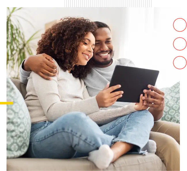 man and woman looking at tablet shopping online life insurance