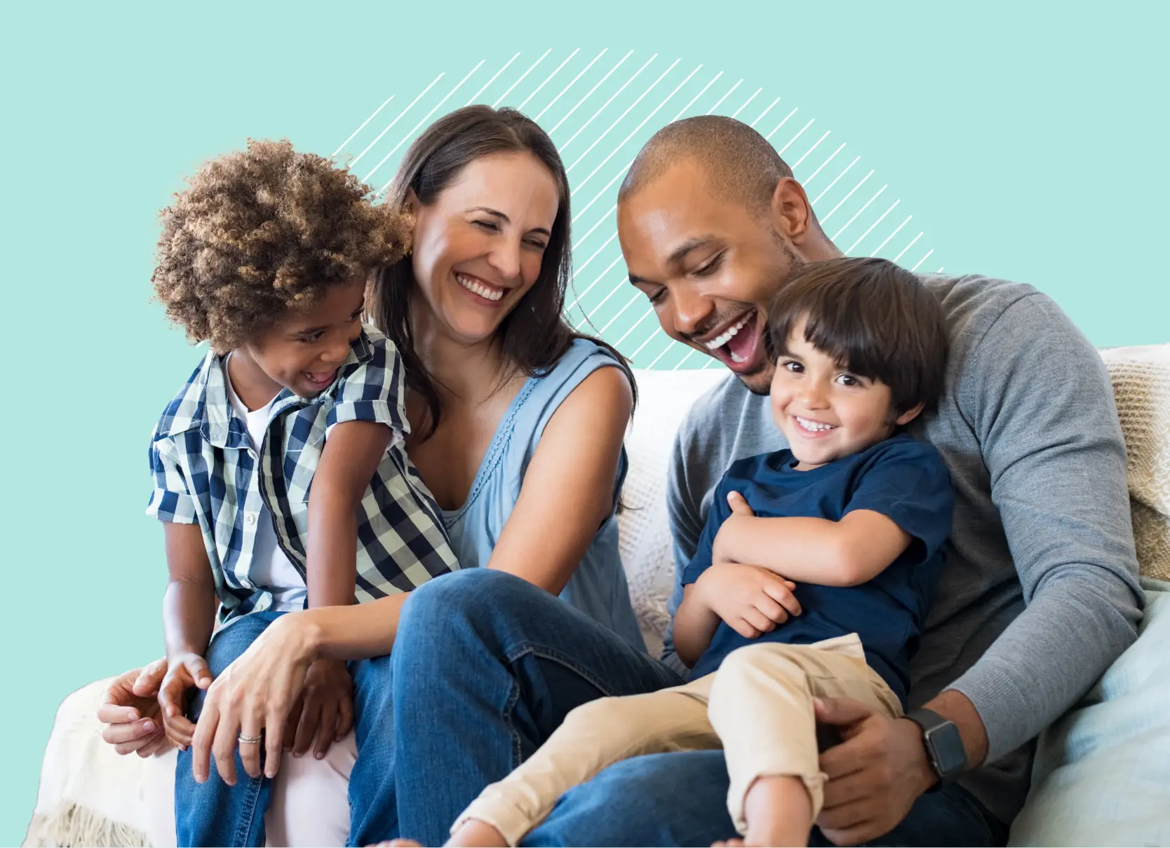 Mom and dad with two children sitting on couch