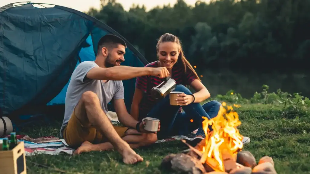 couple by campfire with life insurance